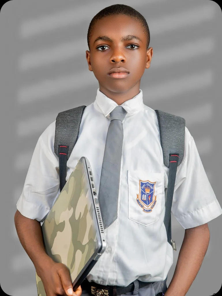 Fame College student in uniform with laptop